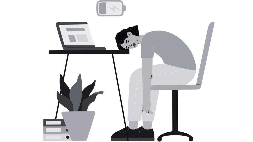 Person exhausted at desk with low battery icon, symbolizing burnout in tech.